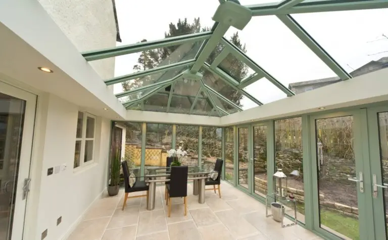 Modern insulated eaves beam with LED downlighters installed in a conservatory roof upgrade in Dorset. As can be seen it changes the look of the room