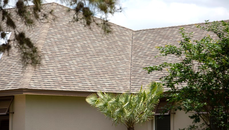 in this picture you can see the large overhang of this roof helping to keep the heat off the walls and windows, and if you look closely you can also see the added window shutters