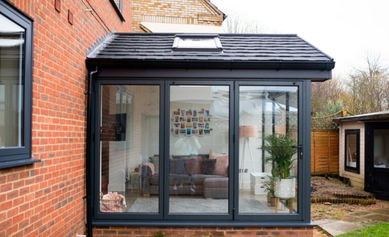 3 types of products in windows and doors show in this image, bi-folds, roof light and a window